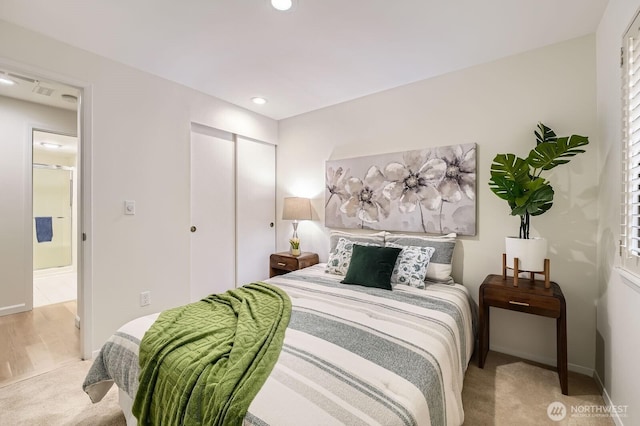 16142 SE 33rd Ln, Unit Bellevue, WA 98008 - carpeted bedroom with a closet and recessed lighting