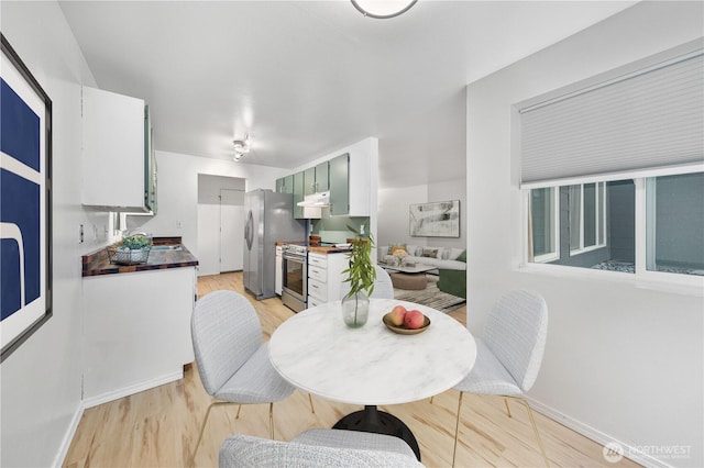 7021 Sand Point Way NE Unit B201, Seattle, WA 98115 - dining room featuring light wood-style flooring and baseboards