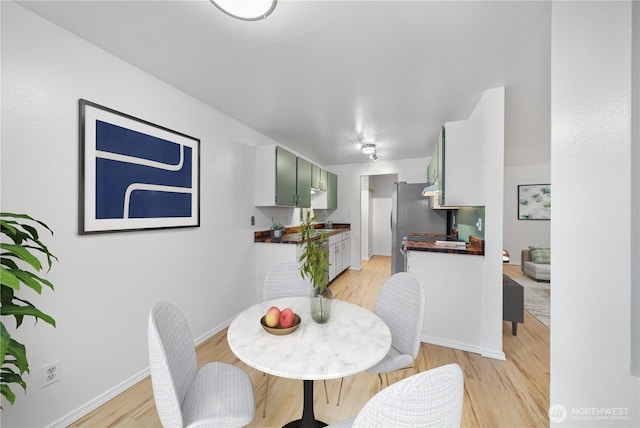 7021 Sand Point Way NE Unit B201, Seattle, WA 98115 - dining area featuring light wood finished floors and baseboards