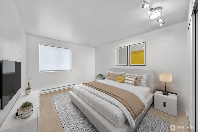 7021 Sand Point Way NE Unit B201, Seattle, WA 98115 - bedroom with a baseboard radiator and light carpet