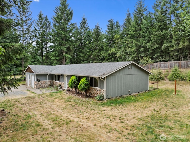 19221 Patterson Rd E, Orting, WA 98360 - ranch-style home featuring stone siding, a garage, a shingled roof, and crawl space