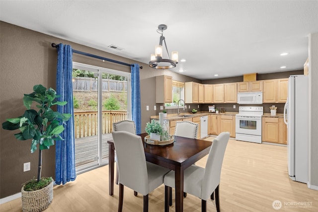 19221 Patterson Rd E, Orting, WA 98360 - dining area with a chandelier, light wood-type flooring, and recessed lighting