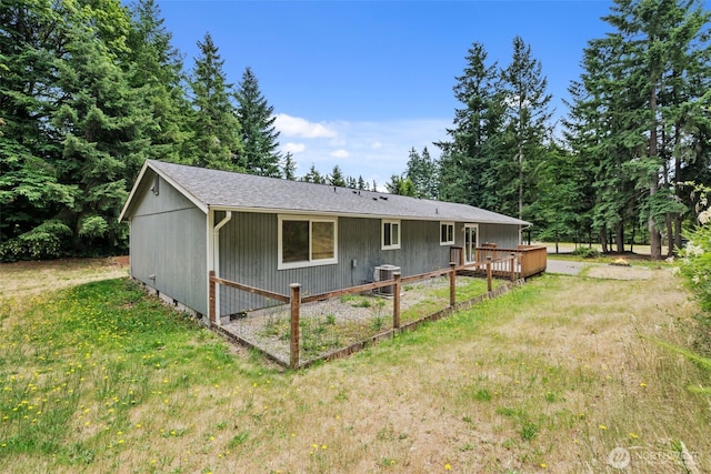 19221 Patterson Rd E, Orting, WA 98360 - view of front of property with a front yard, a wooden deck, and a shingled roof
