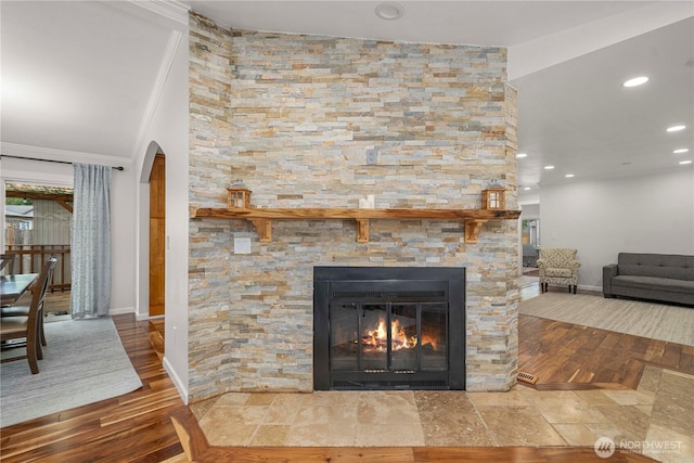 4248 A St SE Unit 423, Auburn, WA 98002 - detailed view of arched walkways, wood finished floors, recessed lighting, a fireplace, and ornamental molding