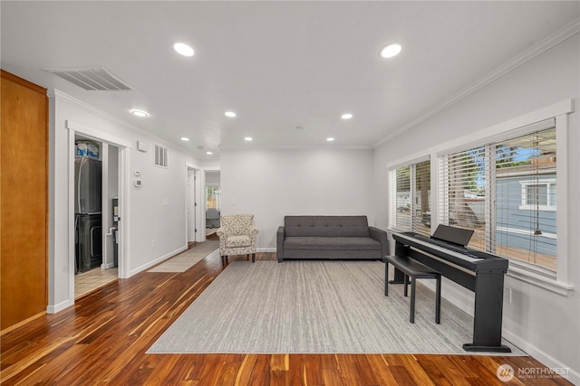 4248 A St SE Unit 423, Auburn, WA 98002 - living area featuring wood finished floors, crown molding, and recessed lighting