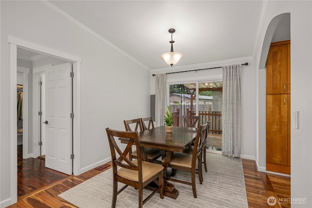 4248 A St SE Unit 423, Auburn, WA 98002 - dining room featuring wood finished floors, arched walkways, and crown molding