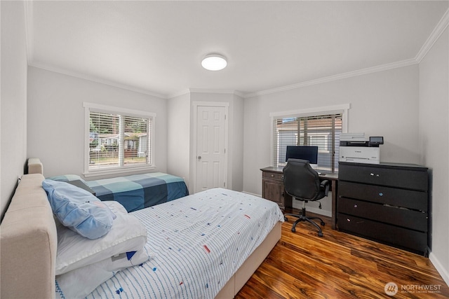 4248 A St SE Unit 423, Auburn, WA 98002 - bedroom featuring ornamental molding, wood finished floors, and multiple windows