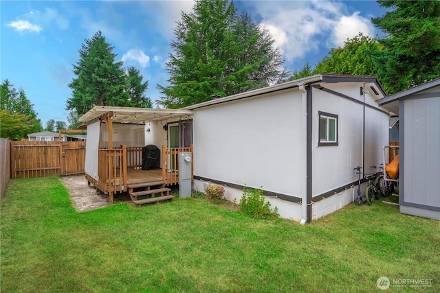 4248 A St SE Unit 423, Auburn, WA 98002 - rear view of property with a wooden deck