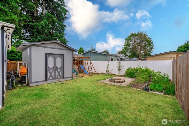 4248 A St SE Unit 423, Auburn, WA 98002 - fenced backyard featuring a playground, a shed, and an outdoor fire pit