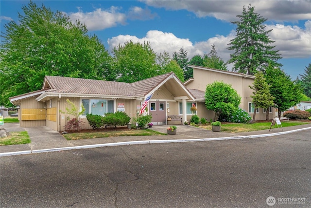 4248 A St SE Unit 423, Auburn, WA 98002 - view of front of home with a tile roof