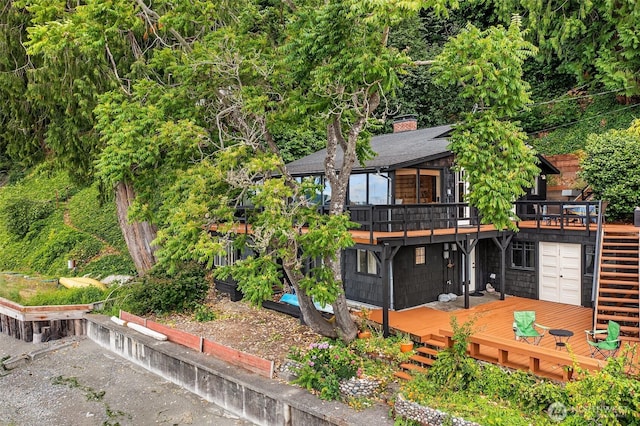 11212 SW 125th St, Vashon, WA 98070 - back of property with a wooden deck, a chimney, and stairs