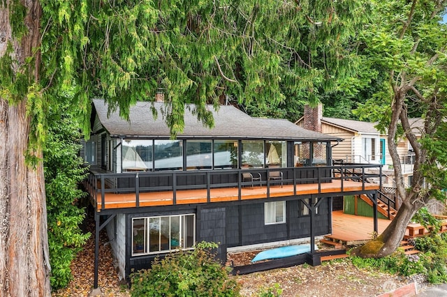 11212 SW 125th St, Vashon, WA 98070 - rear view of property featuring a deck, a shingled roof, and stairs
