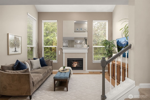 23501 112th Ave SE Unit F103, Kent, WA 98031 - living room featuring a fireplace and wood finished floors