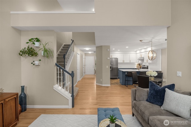 23501 112th Ave SE Unit F103, Kent, WA 98031 - living room with stairs, light wood-style floors, and recessed lighting