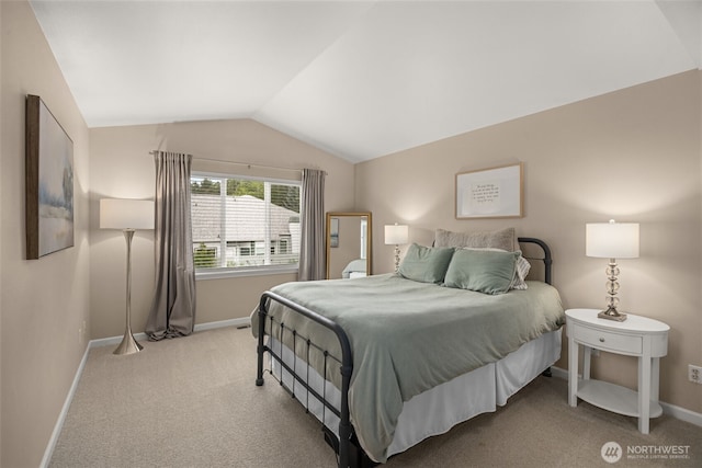 23501 112th Ave SE Unit F103, Kent, WA 98031 - carpeted bedroom featuring lofted ceiling and baseboards