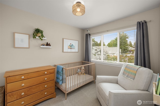 23501 112th Ave SE Unit F103, Kent, WA 98031 - bedroom with light carpet and a nursery area