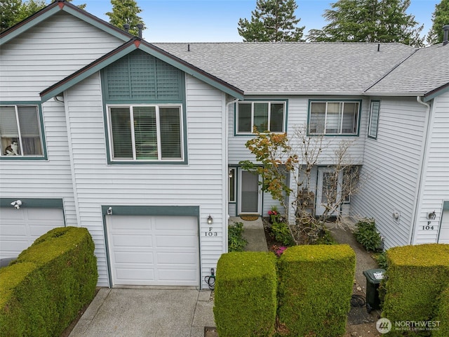 23501 112th Ave SE Unit F103, Kent, WA 98031 - view of front of house featuring a shingled roof, a garage, and concrete driveway