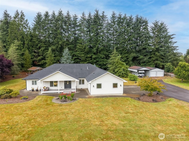 10 Legacy Ln, Elma, WA 98541 - back of property featuring a porch, a lawn, an outdoor structure, and a detached garage