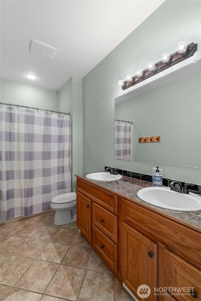 10 Legacy Ln, Elma, WA 98541 - full bath featuring double vanity, tile patterned flooring, and a shower with curtain