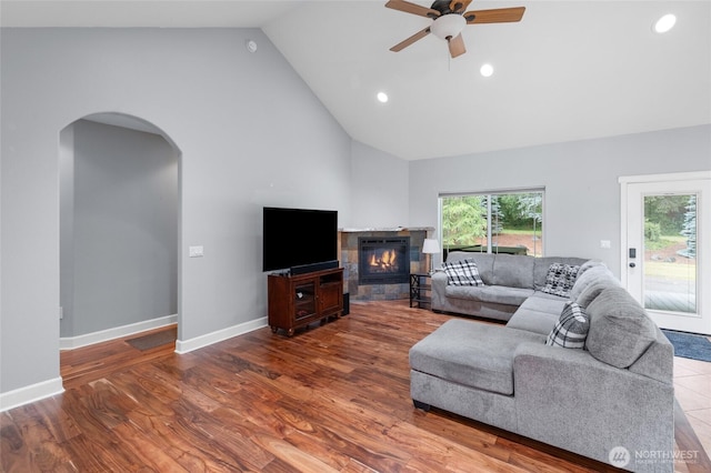 10 Legacy Ln, Elma, WA 98541 - living area featuring arched walkways, ceiling fan, high vaulted ceiling, a glass covered fireplace, and recessed lighting