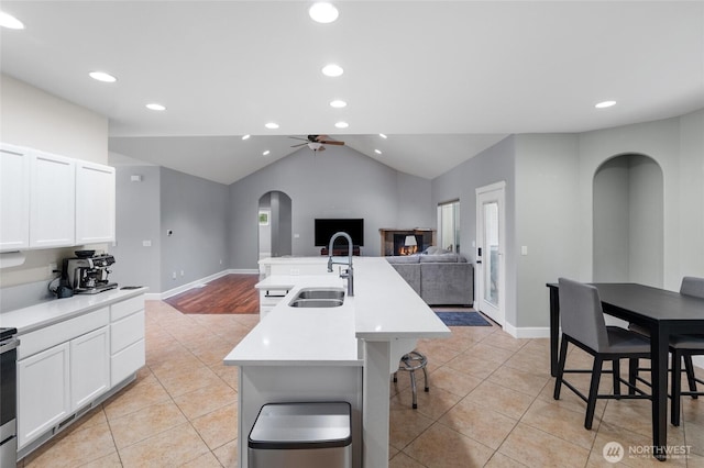 10 Legacy Ln, Elma, WA 98541 - kitchen with open floor plan, arched walkways, light tile patterned flooring, ceiling fan, and lofted ceiling