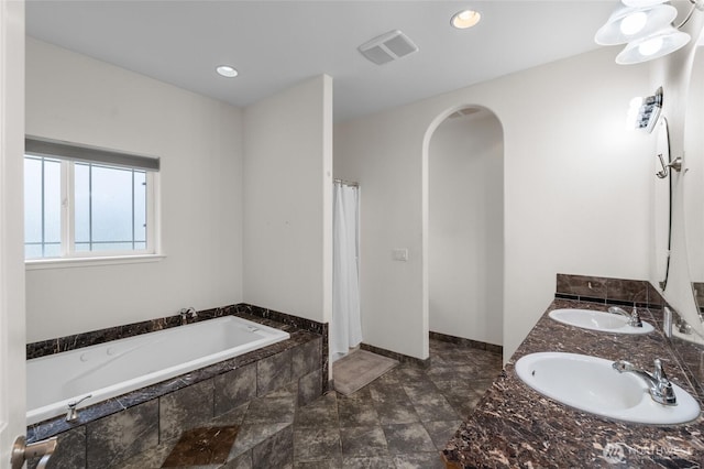 10 Legacy Ln, Elma, WA 98541 - bathroom featuring a garden tub, double vanity, and a shower with shower curtain