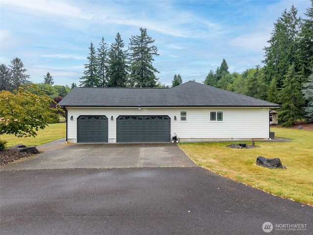 10 Legacy Ln, Elma, WA 98541 - view of property exterior featuring a lawn, asphalt driveway, and a garage