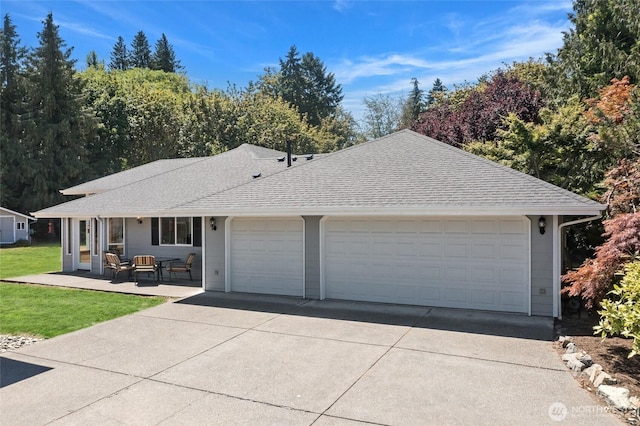 7104 84th St E, Puyallup, WA 98371 - ranch-style home with a shingled roof, concrete driveway, a front lawn, and an attached garage