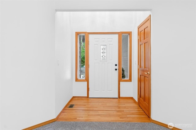 7104 84th St E, Puyallup, WA 98371 - entryway with light wood finished floors and baseboards