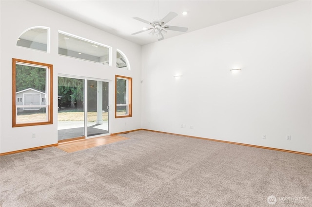 7104 84th St E, Puyallup, WA 98371 - carpeted spare room with ceiling fan, recessed lighting, and a towering ceiling