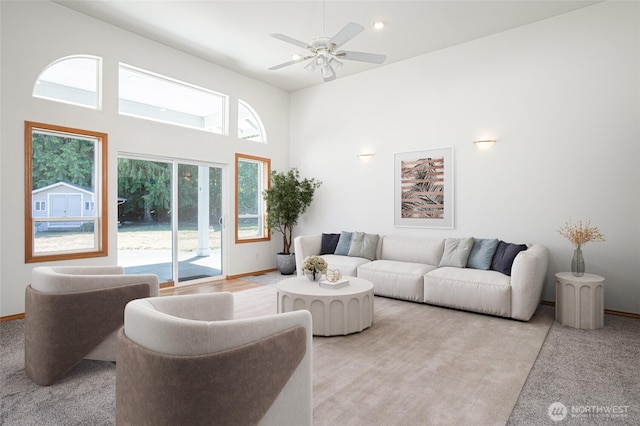 7104 84th St E, Puyallup, WA 98371 - living room with ceiling fan, light carpet, and a high ceiling