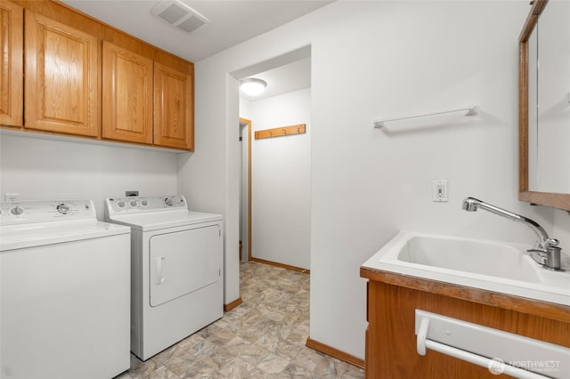 7104 84th St E, Puyallup, WA 98371 - laundry area featuring separate washer and dryer and cabinet space