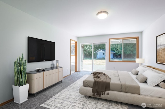 7104 84th St E, Puyallup, WA 98371 - bedroom with access to outside and dark colored carpet