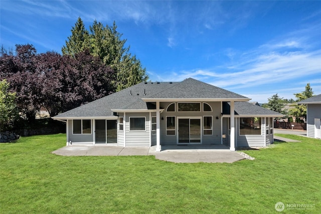 7104 84th St E, Puyallup, WA 98371 - rear view of house featuring a patio, roof with shingles, and a lawn