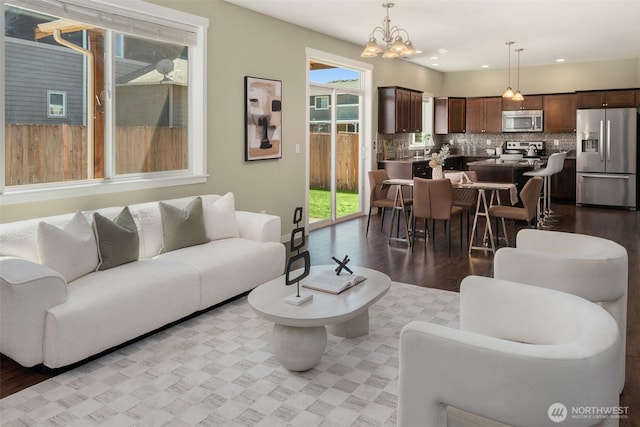 15230 Kayla St SE, Yelm, WA 98597 - living area featuring a chandelier, wood finished floors, and recessed lighting