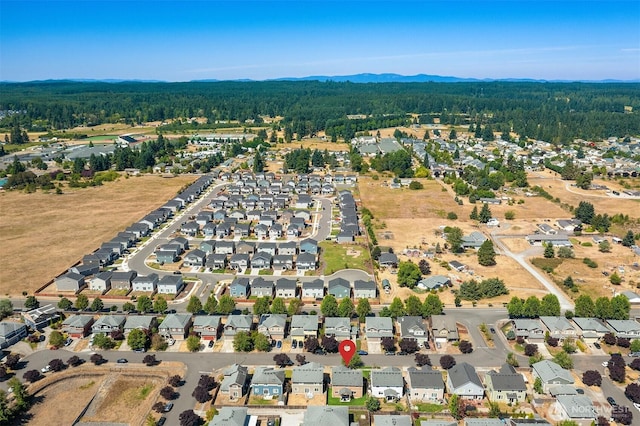 15230 Kayla St SE, Yelm, WA 98597 - aerial perspective of suburban area with a forest