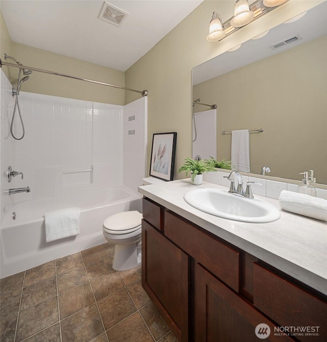 15230 Kayla St SE, Yelm, WA 98597 - bathroom featuring shower / bathtub combination, vanity, and stone finish floors