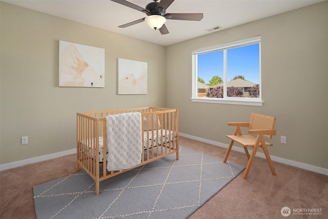15230 Kayla St SE, Yelm, WA 98597 - carpeted bedroom featuring a nursery area and a ceiling fan