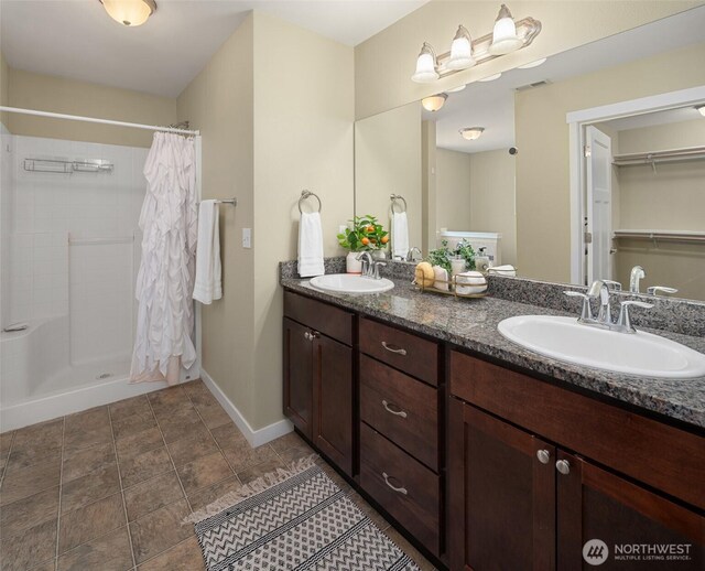 15230 Kayla St SE, Yelm, WA 98597 - full bath with double vanity and a tile shower