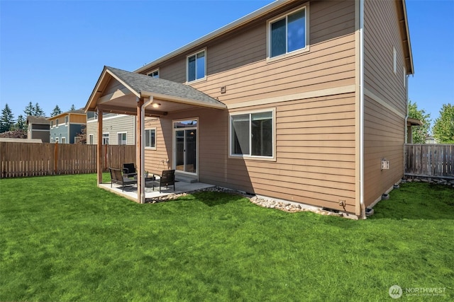 15230 Kayla St SE, Yelm, WA 98597 - back of house with a patio area and a fenced backyard