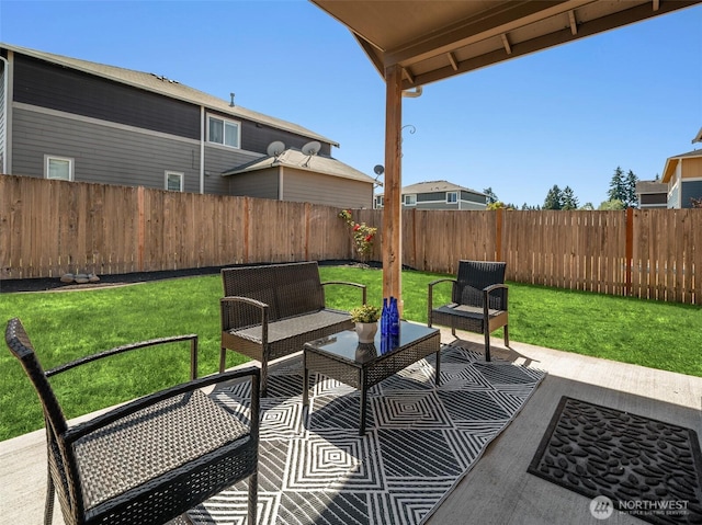 15230 Kayla St SE, Yelm, WA 98597 - fenced backyard featuring an outdoor hangout area and a patio area