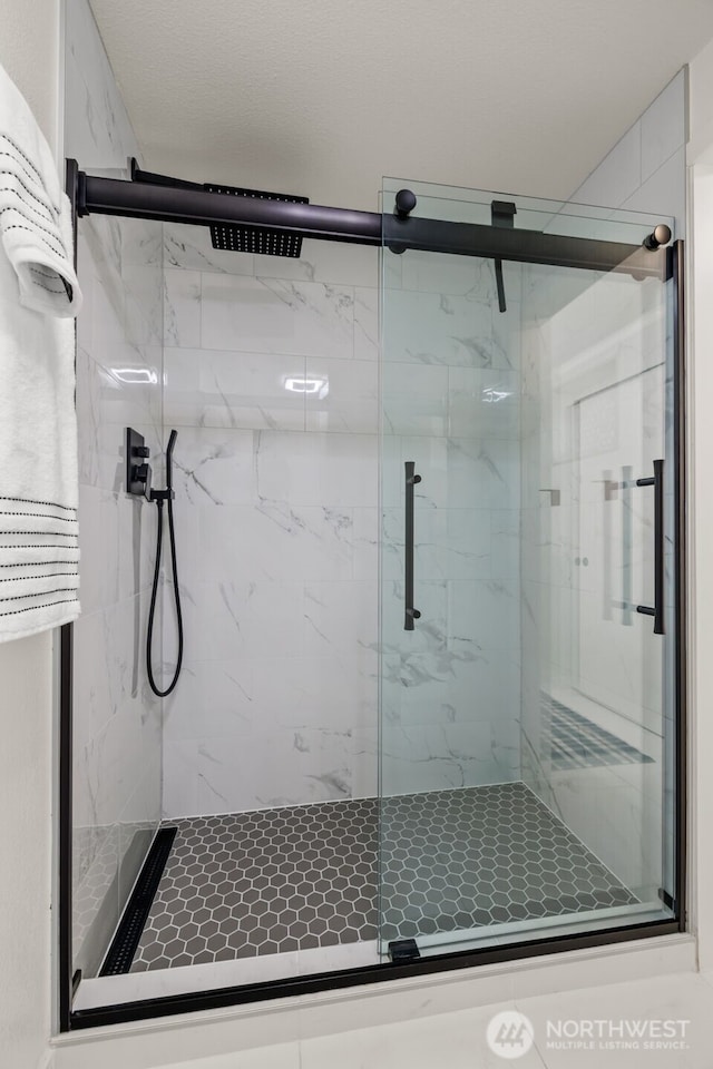 12618 109th Ct NE Unit H102, Kirkland, WA 98034 - full bathroom with a marble finish shower