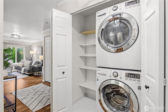 12618 109th Ct NE Unit H102, Kirkland, WA 98034 - laundry room with estacked washer and dryer and wood finished floors