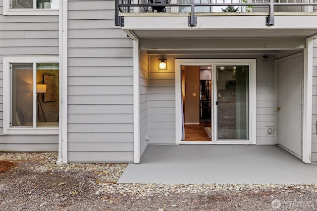 12618 109th Ct NE Unit H102, Kirkland, WA 98034 - doorway to property with a balcony