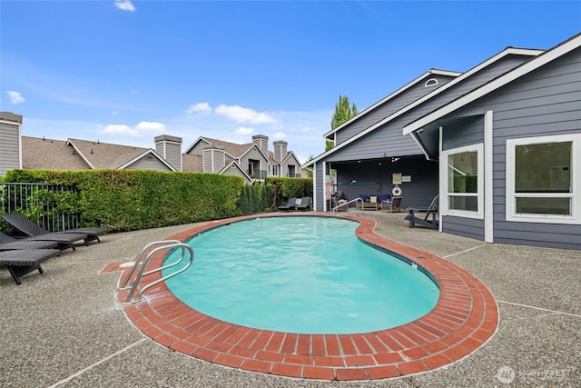 12618 109th Ct NE Unit H102, Kirkland, WA 98034 - view of swimming pool with a patio and a fenced backyard
