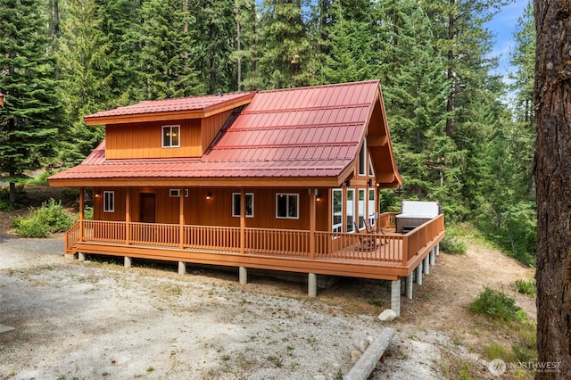 18725 River Rd, Leavenworth, WA 98826 - rustic home featuring a view of trees and covered porch