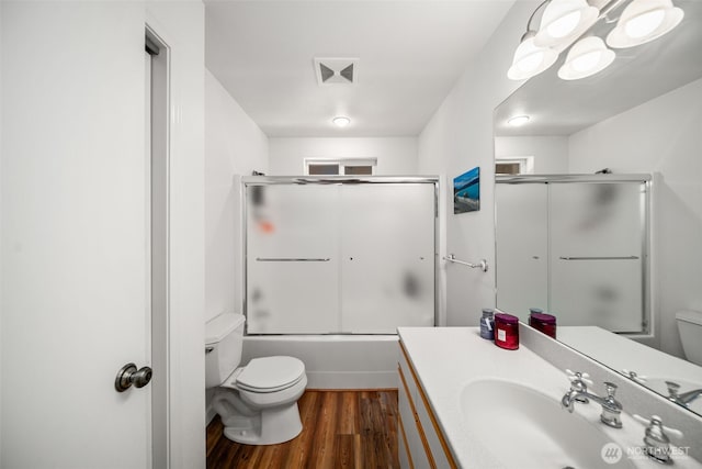 18725 River Rd, Leavenworth, WA 98826 - bathroom with vanity, wood finished floors, and enclosed tub / shower combo