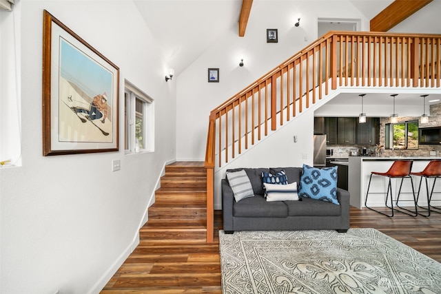 18725 River Rd, Leavenworth, WA 98826 - living room with dark wood-type flooring, stairs, high vaulted ceiling, and beamed ceiling