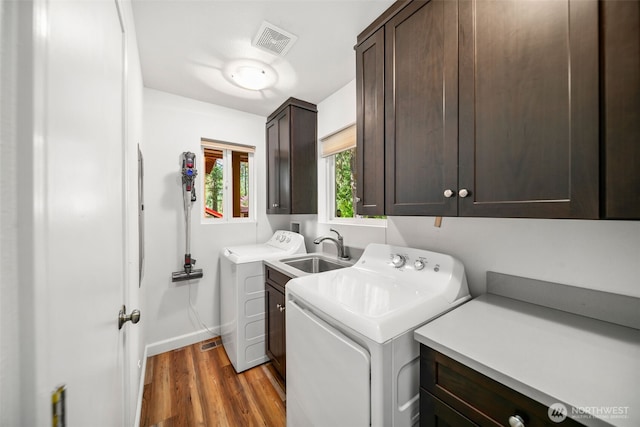 18725 River Rd, Leavenworth, WA 98826 - laundry area with cabinet space, separate washer and dryer, and wood finished floors
