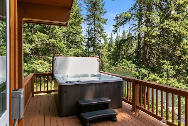 18725 River Rd, Leavenworth, WA 98826 - wooden deck with a hot tub and view of scattered trees